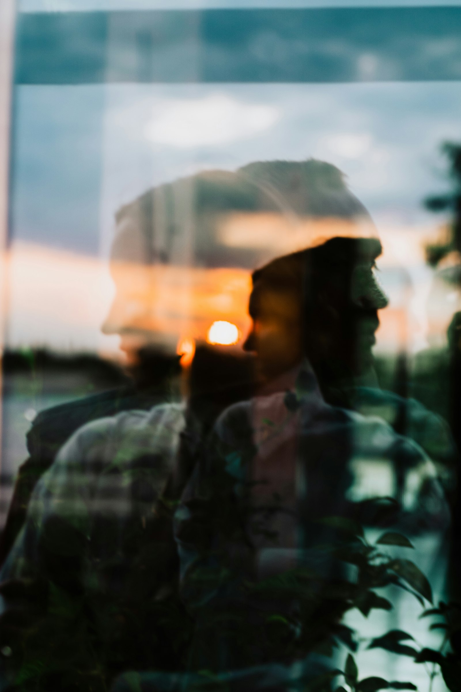 Man reflected in a window, contemplating life's big questions